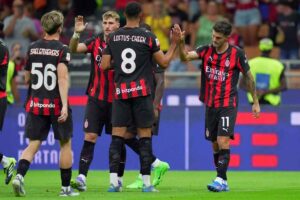 giocatori del Milan si danno il cinque